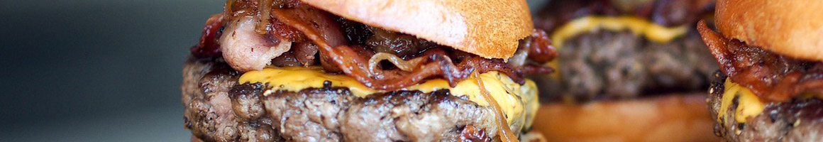 Eating Burger at Hamburger Harrys II restaurant in Edmonds, WA.